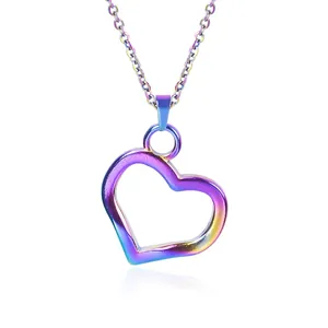 Macro detail of iridescent heart pendant on fine chain with a glossy reflective finish