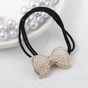 Élastique à cheveux noir élégant avec un nœud doré orné de perles et de strass brillants