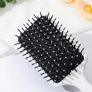 Square cushion hairbrush with Capybara print and massaging bristles for long hair