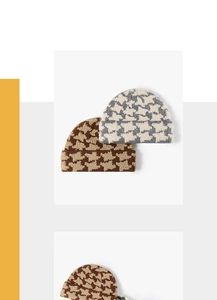 Close-up of houndstooth knit beanie showing thick warm wool texture and patterns