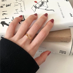 Minimalist S925 sterling silver ring with oval geometric design in golden finish on hand