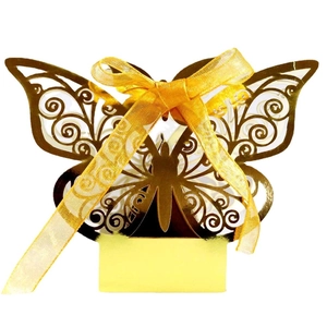 Golden laser-cut butterfly wedding favor box with shiny finish and organza ribbon bow