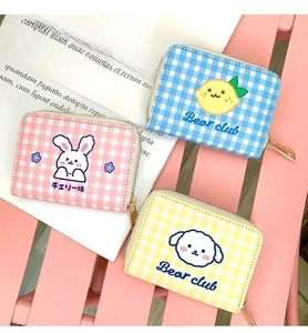 Detailed view of mini cartoon plaid wallets in pink, blue and yellow with metal zippers