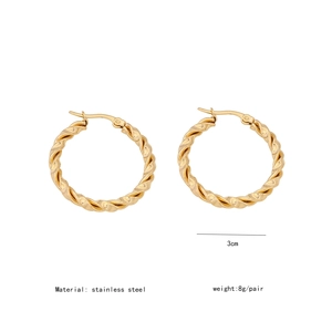 Detail view of 3cm twisted gold stainless steel C-shape hoops with weight and size specs