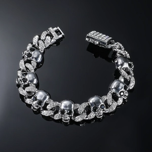 Close-up of silver skull link bracelet with pavé rhinestones and jewelry clasp detail