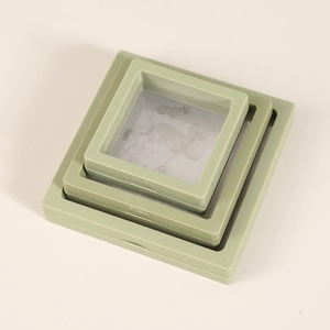 Three sizes of sage green PE membrane jewelry display boxes in a stacked overhead view