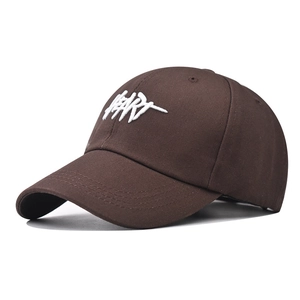 Detail of 3D white HEART embroidery on brown cotton baseball cap with curved brim