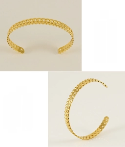 Détail du bracelet tressé ajouré plaqué or 18K montrant l'acier sans plomb poli