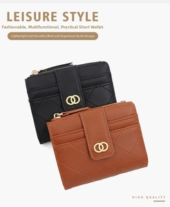 Close-up of quilted women's wallet with gold ring buckle in black and brown faux leather