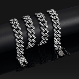 Detailed view of a 14mm black rhombic Cuban link chain with sparkling diamond-set pave