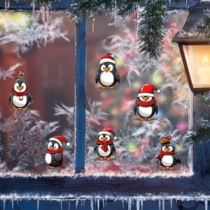 Christmas penguin wall stickers on a snowy window with festive warm lights background