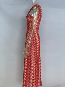 Detail of slim-fit sleeveless maxi dress with red and orange chevron knit pattern
