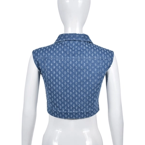 Detailed back view of cropped blue denim vest featuring distressed ripped texture and frayed edges