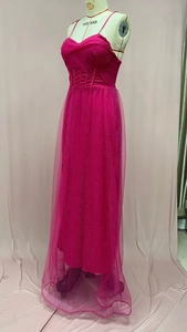 Detail of rose red maxi dress showing sparkly glitter mesh fabric and waist boning