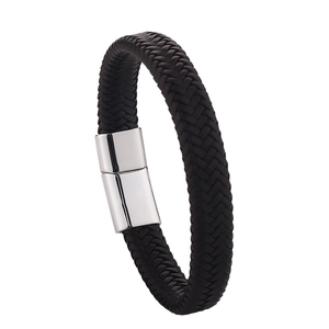 Close-up of black braided leather bracelet featuring a polished silver magnetic clasp closure