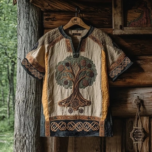 Detailed close-up of Tree of Life embroidery and Celtic patterns on a linen men's shirt