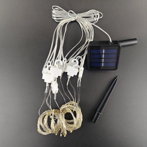 Solar curtain light kit with charging panel, ground stake, and flexible copper wire
