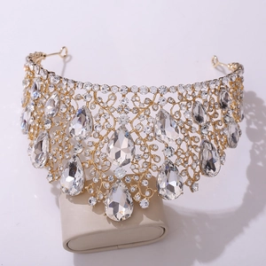 Detailed 45-degree macro view of luxury gold bridal tiara with teardrop crystals