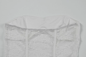 Detailed view of white floral lace corset with boning structure and sweetheart neckline