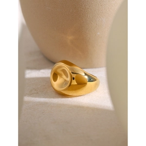 Minimalist chunky 18k gold plated stainless steel spiral ring on stone pedestal