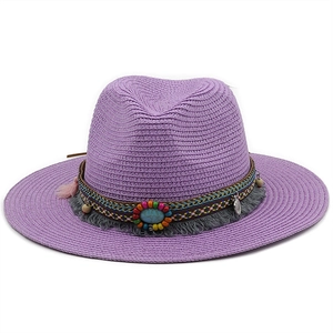 Detail of purple straw fedora hat with bohemian woven band and turquoise beaded tassels