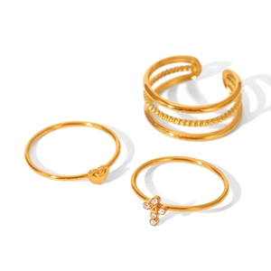 Three-piece gold plated stainless steel ring set including wave, heart and cross designs