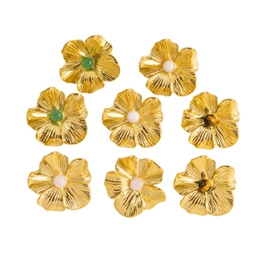 Detailed view of gold 3D flower earrings with colorful inlaid natural stone beads