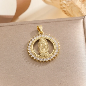 Detail of gold circular Virgin Mary pendant featuring pavé-set colorful cubic zirconia stones