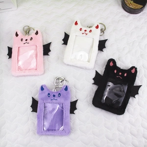 Plush bat photocard holders in pink, white, purple and black with devil wings