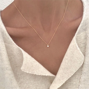 Minimalist 925 sterling silver necklace featuring a sparkling round zircon pendant
