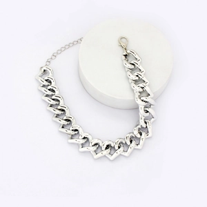 Close-up of adjustable silver heart-link pet necklace with lobster clasp and extension chain