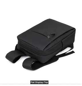 Flat lay view of a black USB charging business backpack with waterproof fabric texture
