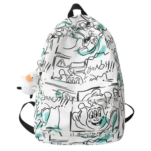 Detail of graffiti print backpack with turquoise accents and plush duck charm