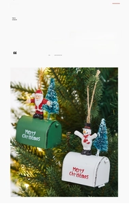 Close-up of metal Christmas mailbox ornaments with Santa and Snowman on tree branch