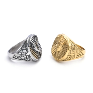 Macro shot of gold and silver ancient Egyptian Pharaoh relief rings in vintage steel
