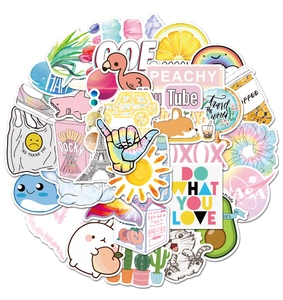 Detailed stacked view of colorful VSCO stickers for luggage and laptop customization