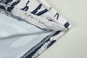 Detailed close-up of zebra print fabric showing precise stitching and hem craftsmanship