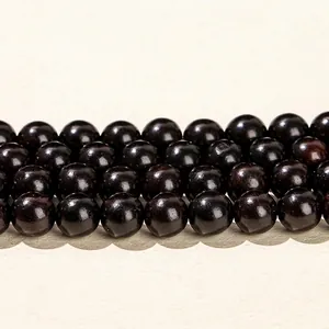 Polished dark brown Golden Silk Sandalwood beads with natural wood grain for DIY jewelry making