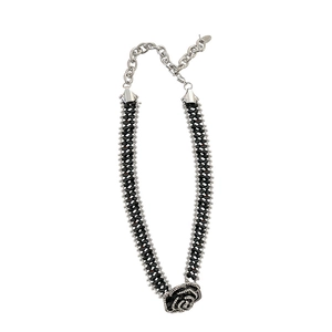 Elegant black crystal beaded choker necklace featuring a central rose pendant with silver rhinestones