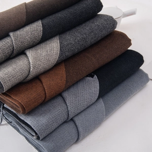 Soft thick pashmina-style scarves in dark brown, grey, and black with fringe detail