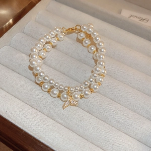 Double-layer pearl bracelet with a gold zircon-inlaid mermaid tail pendant for women