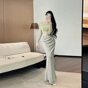 Detail of light green mesh pleated top and grey-green satin mermaid skirt outfit