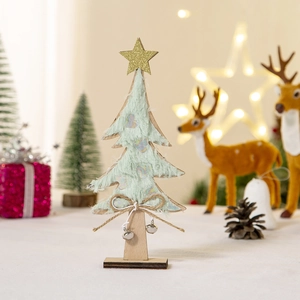 Detail of light green plush Christmas tree with golden star and metal bells