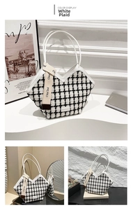 Close-up of black and white checkered tweed tote bag with premium white leather handles