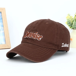 Detailed view of Devise 3D embroidery on deep brown cotton twill baseball cap