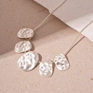 Minimalist hammered texture necklace with irregular silver oval pendants on snake chain