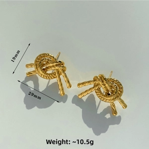 Detail showing dimensions of 19mm by 29mm for these gold woven knot stud earrings