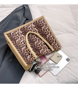 Detail showing high-capacity interior of leopard print linen tote bag with essentials
