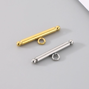 Macro shot of gold and silver cylinder toggle clasps for DIY jewelry connectors