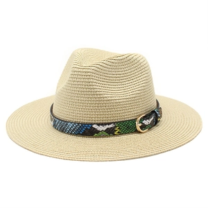 Close-up of beige straw fedora hat featuring a colorful snakeskin pattern decorative band